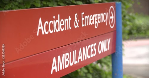 4K Healthcare: focus pull into hospital sign for accident and emergency and ambulances only.