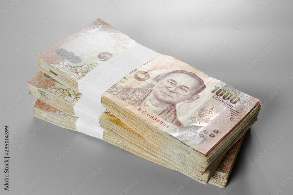 Thai baht banknote. Business and Finance concept. Bulk of banknote on white background. Thai baht banknote. Business and Finance concept. Bulk of banknote on white background.