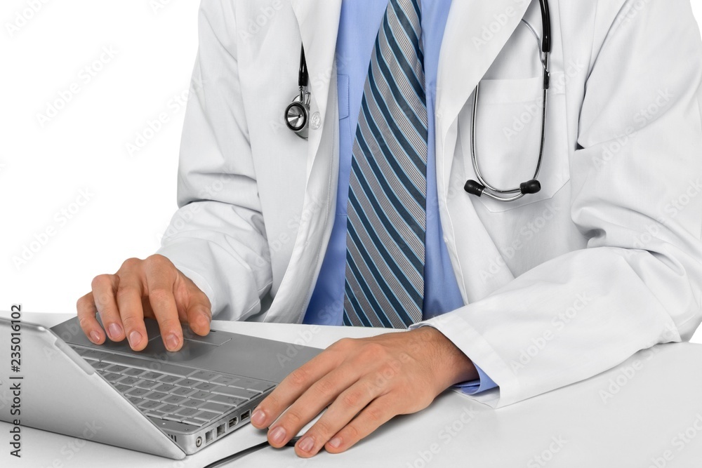 Closeup of Doctor Typing on Laptop Closeup of Doctor Typing on Laptop
