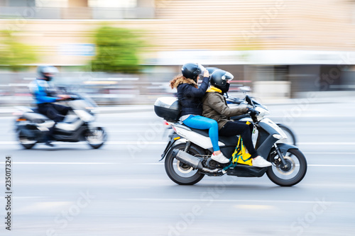 motorcycle rider with pillion in city traffic © Christian Müller