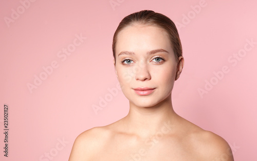 Portrait of beautiful young woman on color background. Lips contouring, skin care and cosmetic surgery concept