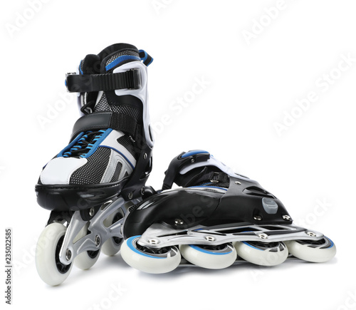 Pair of inline roller skates on white background