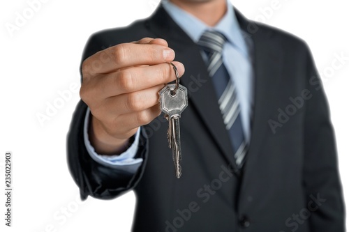 Businessman Handing over the Keys
