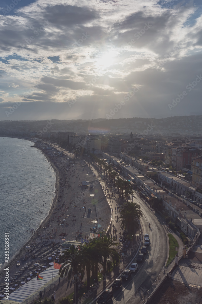 Promenade des Anglais and city of Nice, France, by the sea, from Castle Hill, against the sunlight