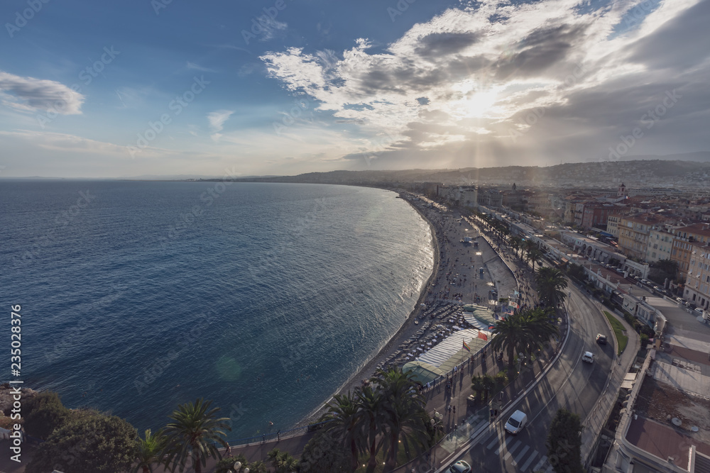 Promenade des Anglais and city of Nice, France, by the sea, from Castle Hill, against the sunlight
