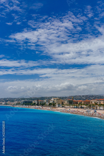 Buildings and beaches next to blue sea in the city of Nice, France © Mark Zhu