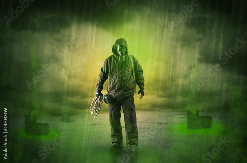 Masked unrecognizable guard in an abandoned space after explosion
