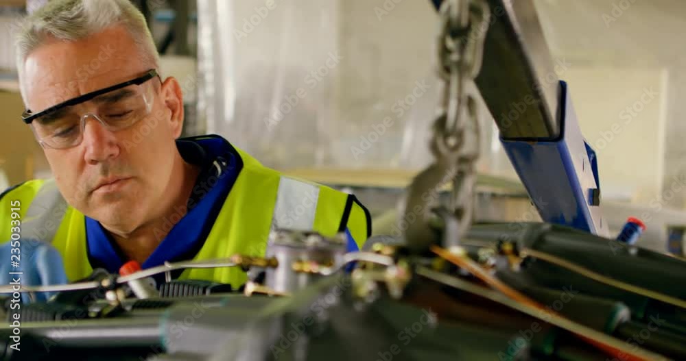 Engineer repairing aircraft engine 4k