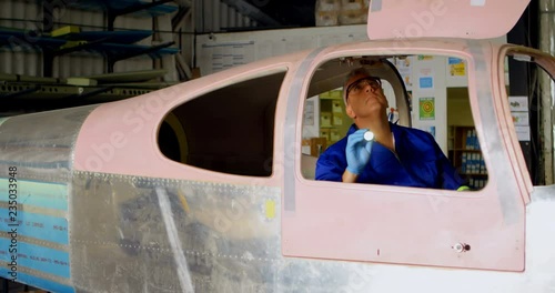 Engineer examining aircraft 4k photo