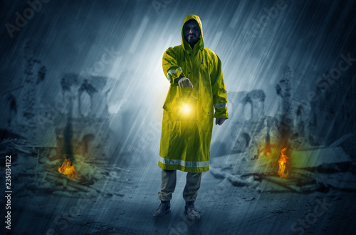 Destroyed place after a catastrophe with man in raincoat and lantern concept  