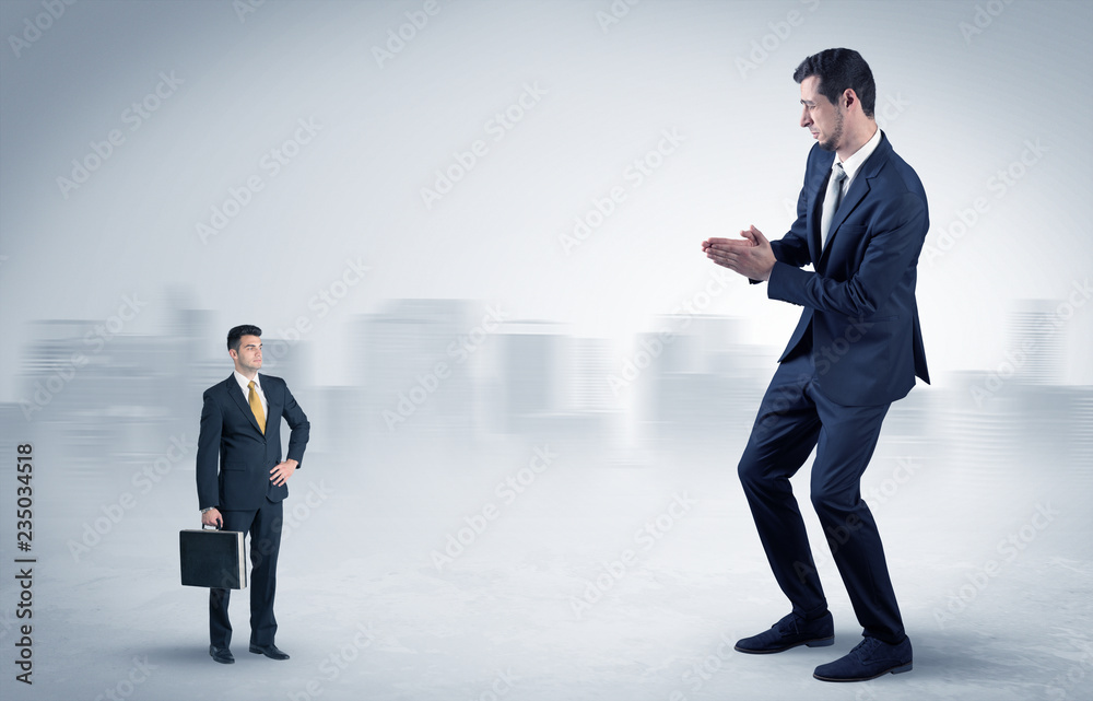 Giant businessman being afraid of small serious executor with suitcase
Giant businessman being afraid of small serious executor with suitcase