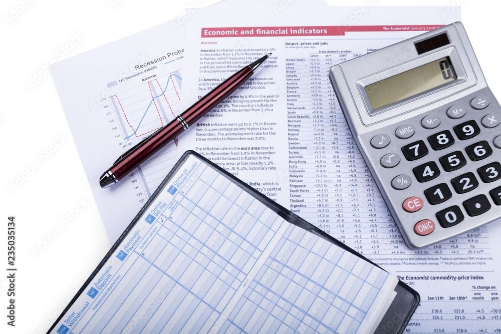 Calculator, Pen and Checkbook on Financial Figures Calculator, Pen and Checkbook on Financial Figures