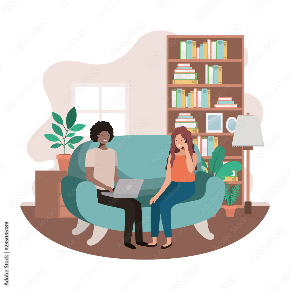 couple using technology devices in the livingroom couple using technology devices in the livingroom