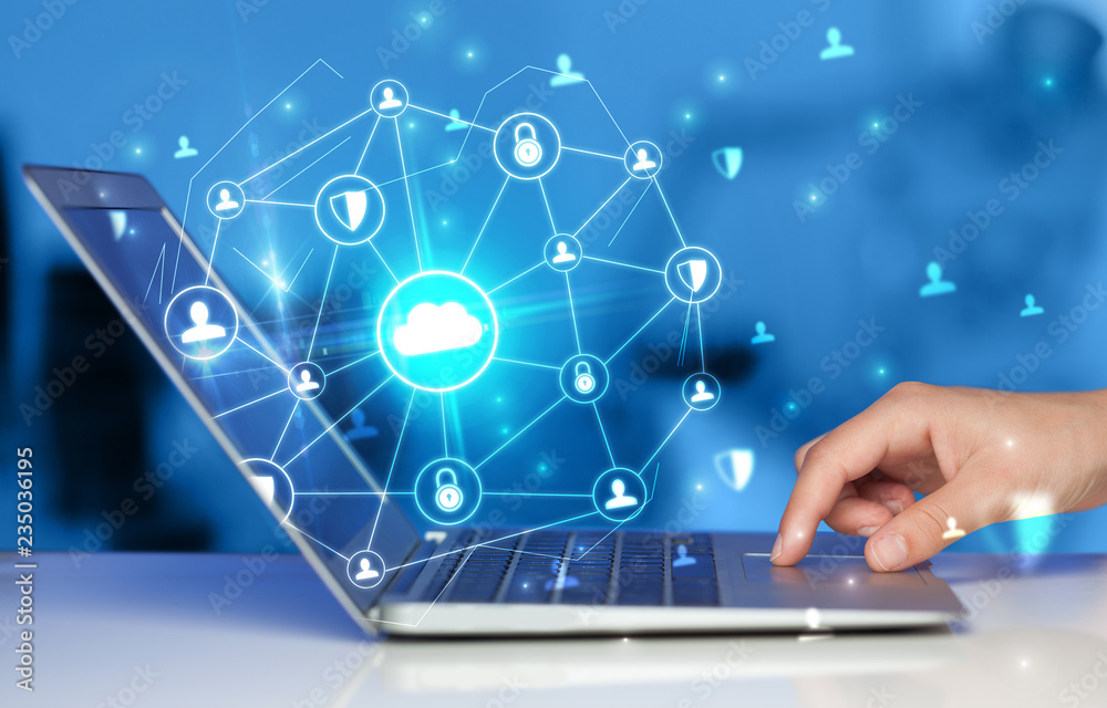 Hand using laptop with centralized cloud computing system and network security concept
Hand using laptop with centralized cloud computing system and network security concept