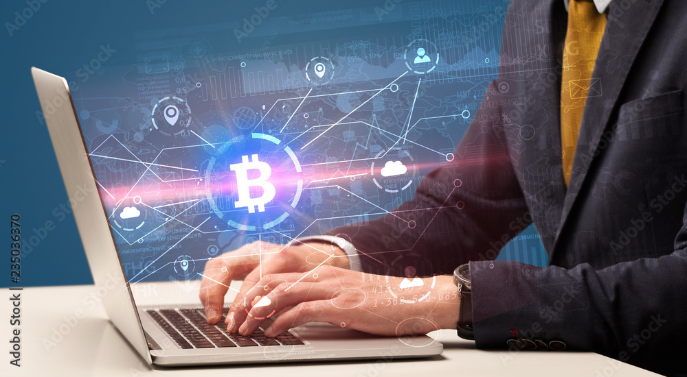 Hand checking on laptop global bitcoin exchange rate concept
Hand checking on laptop global bitcoin exchange rate concept