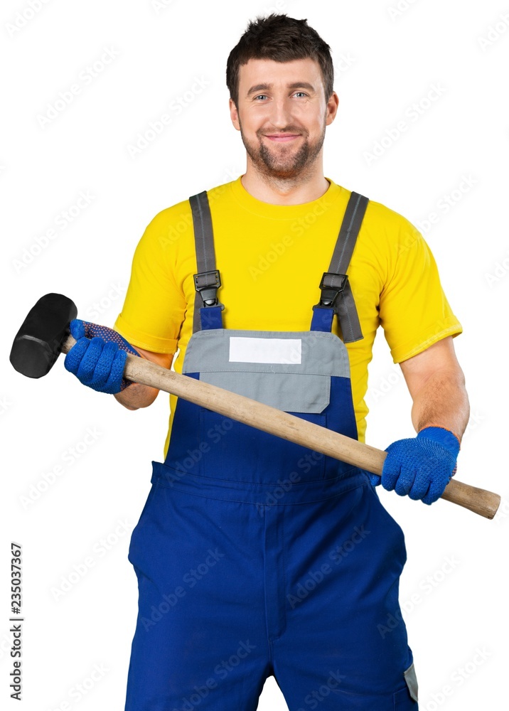Smiling Worker Holding a Sledgehammer Smiling Worker Holding a Sledgehammer