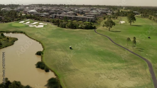 Golfers Driving around the course in Golf Carts
