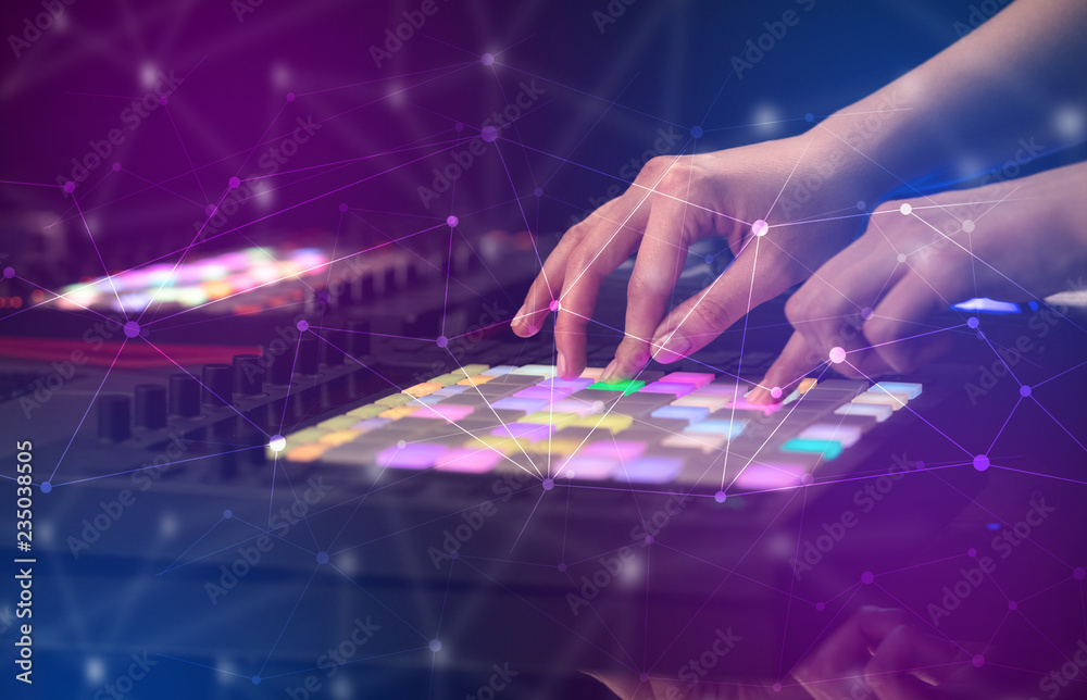 Hand remixing music on midi controller with colorful connectivity concept
Hand remixing music on midi controller with colorful connectivity concept