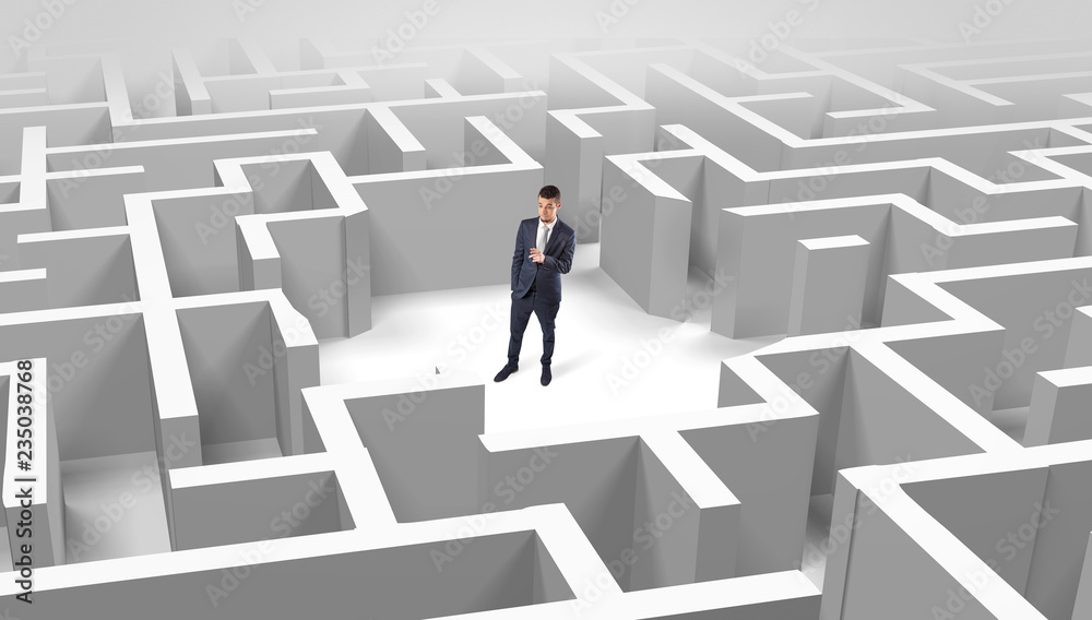 Young businessman standing in a middle of a 3D maze
Young businessman standing in a middle of a 3D maze