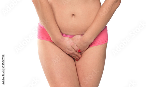 Valokuva female in underwear covering her crotch