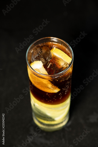 Wallpaper Mural Cuba Libre cocktail with rum, coke and lime juice with lime wedge and full of ices Torontodigital.ca