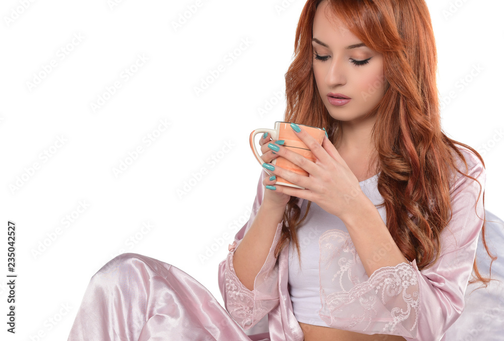 beautiful red headed women drinking coffee-tea and holding cup isolated on white beautiful red headed women drinking coffee-tea and holding cup isolated on white