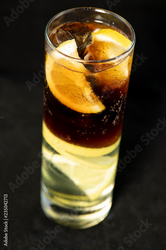 Wallpaper Mural Cuba Libre cocktail with rum, coke and lime juice with lime wedge and full of ices Torontodigital.ca
