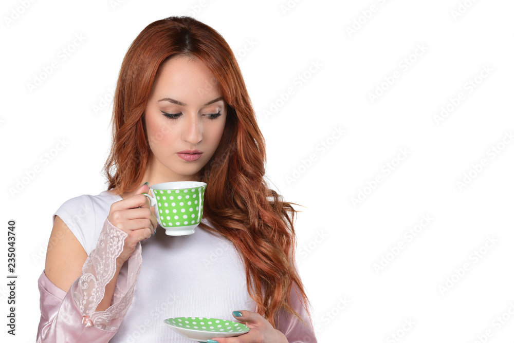 beautiful red headed women drinking coffee-tea and holding cup isolated on white beautiful red headed women drinking coffee-tea and holding cup isolated on white