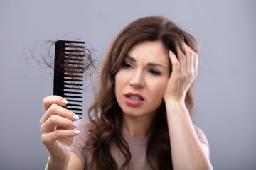 Worried Woman Suffering From Hairloss