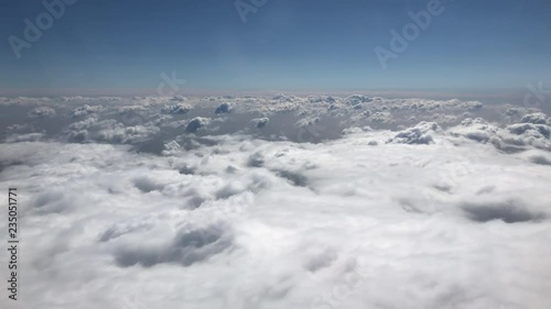 Flying through fluffy white clouds in the sky
