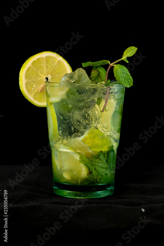 Mojito Cocktail with rum, brown sugar, lemon juice, mint and soda water © Alp Galip