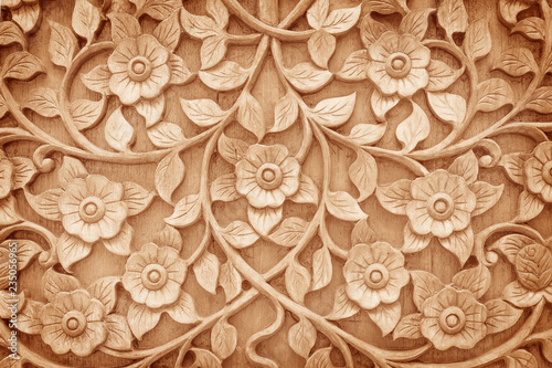 Pattern of flower carved on wood background