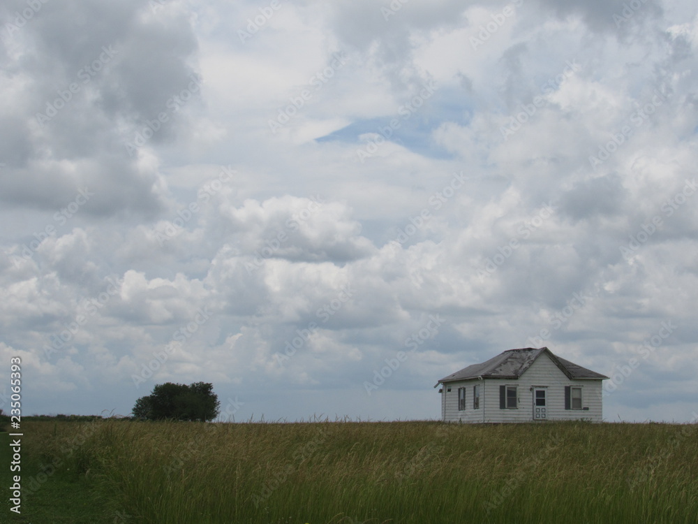Abandoned house in a field Abandoned house in a field