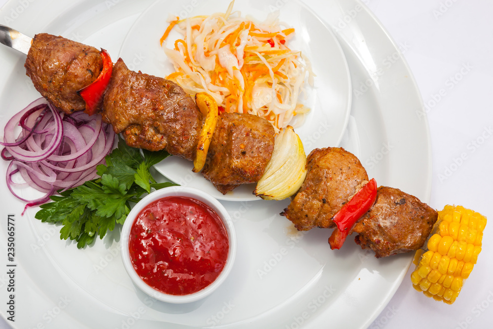 shashlik on skewer with red sauce shashlik on skewer with red sauce