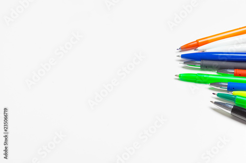 different colors pens isolated on the white background