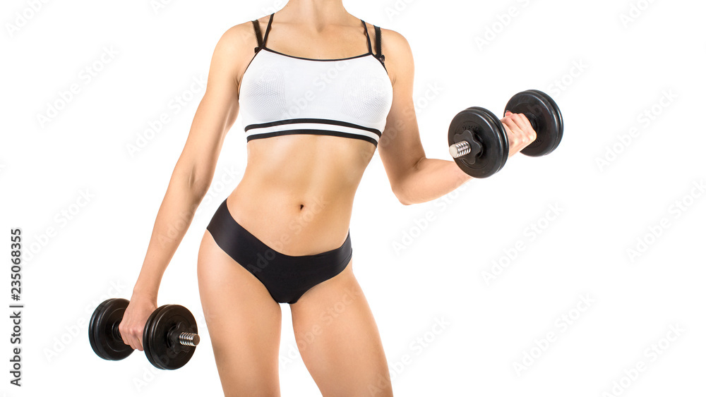 Young woman doing exercise with dumbbells isolated on white background. Cropped image. Young woman doing exercise with dumbbells isolated on white background. Cropped image.