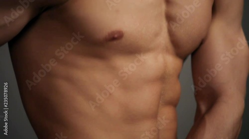 Young topless rolled man posing