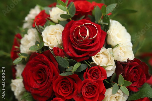 Gold rings on a wedding bouquet