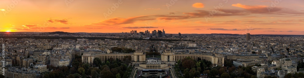 Aerial: Place du Trocadero on the background of the skyscrapers in Paris, sunset, panoramic image