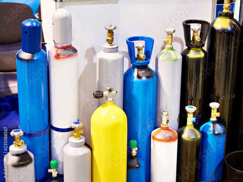 Metal cylinders for compressed gases