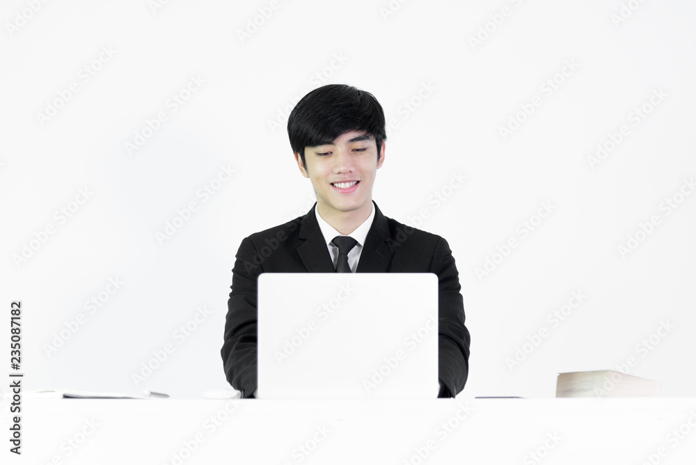 Asian manager businessman sitting at desk and working, isolated on white background. Asian manager businessman sitting at desk and working, isolated on white background.