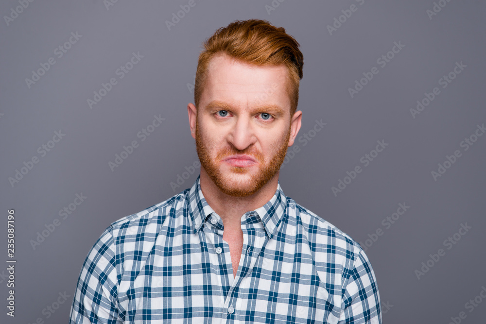 Close-up portrait of sad displeased handsome attractive trendy m Close-up portrait of sad displeased handsome attractive trendy m
