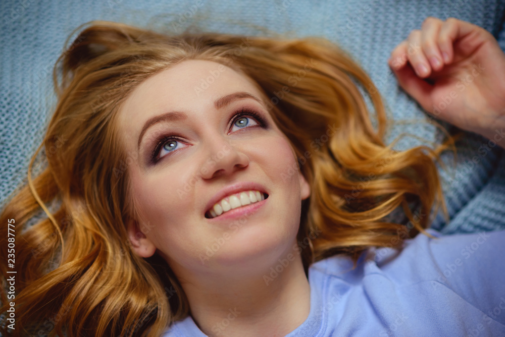 Gigner girl in pajamas lying on a bed. Gigner girl in pajamas lying on a bed.