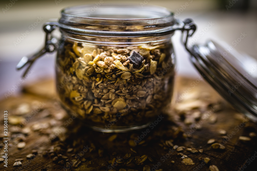 Glass jar with various seeds, oats and cereal. Glass jar with various seeds, oats and cereal.