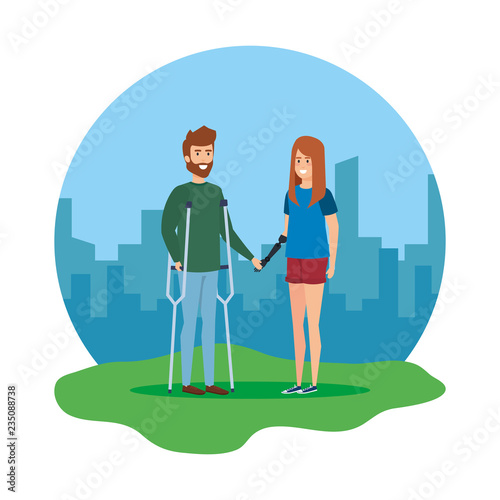 man with crutches and woman with hand prosthesis