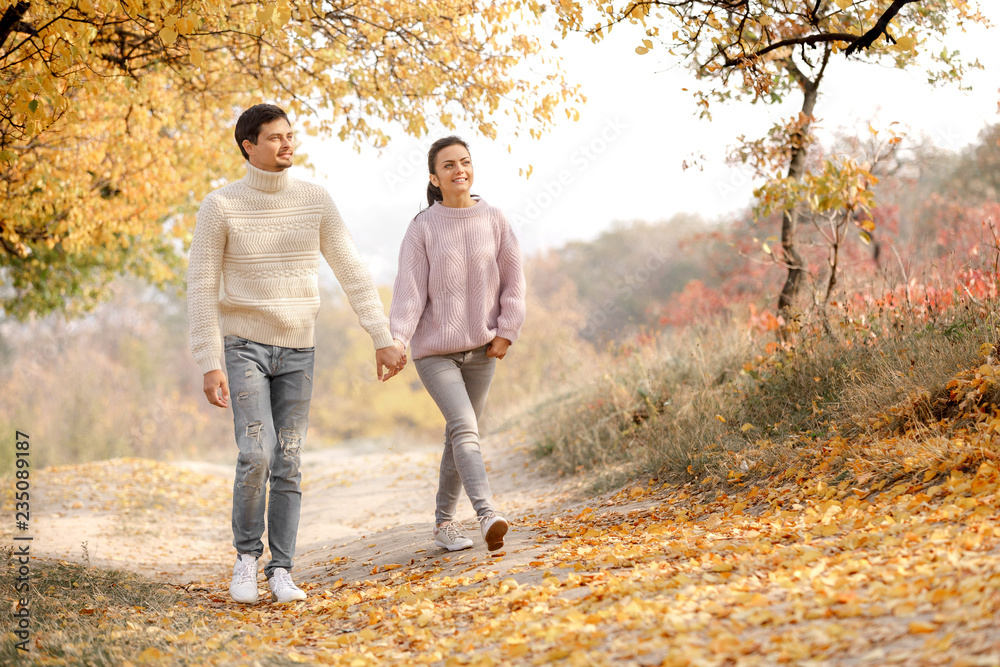 Couple in love in the autumn leaves Couple in love in the autumn leaves