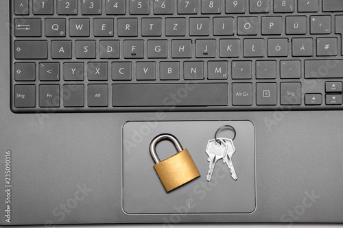 Padlock on Laptop with keys photo