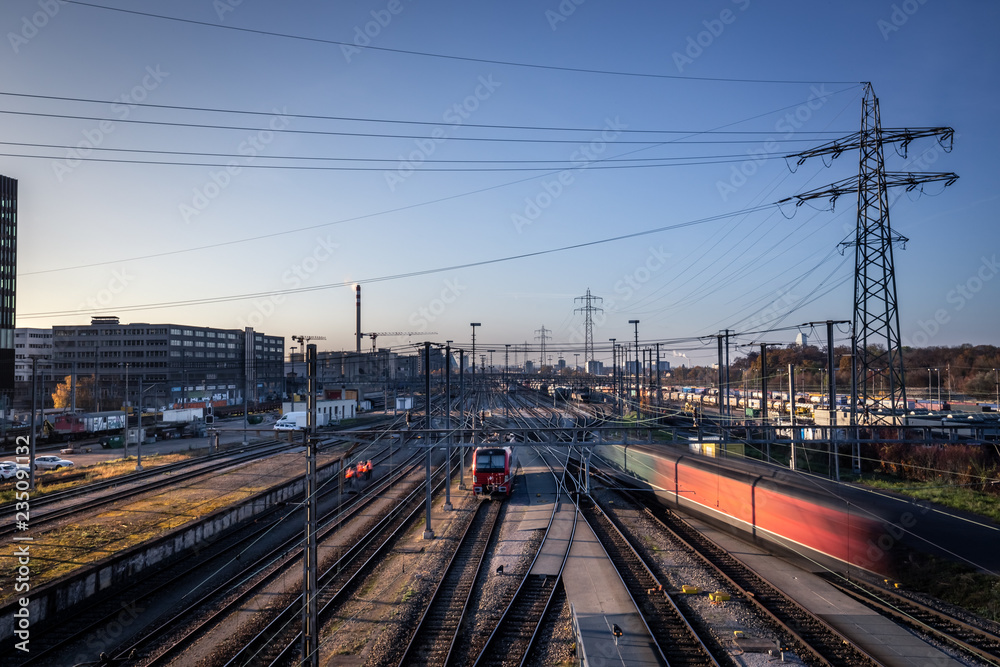 Industrial city railway tracks and moving trains