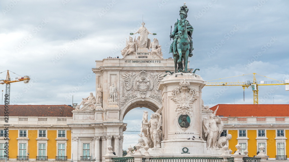 Triumphal arch at Rua Augusta and bronze statue of King Jose I at Commerce square timelapse in Lisbon, Portugal.