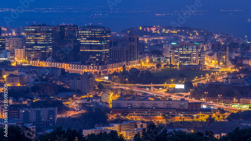 Panoramic View over Lisbon and Almada from a viewpoint in Monsanto night to day timelapse.